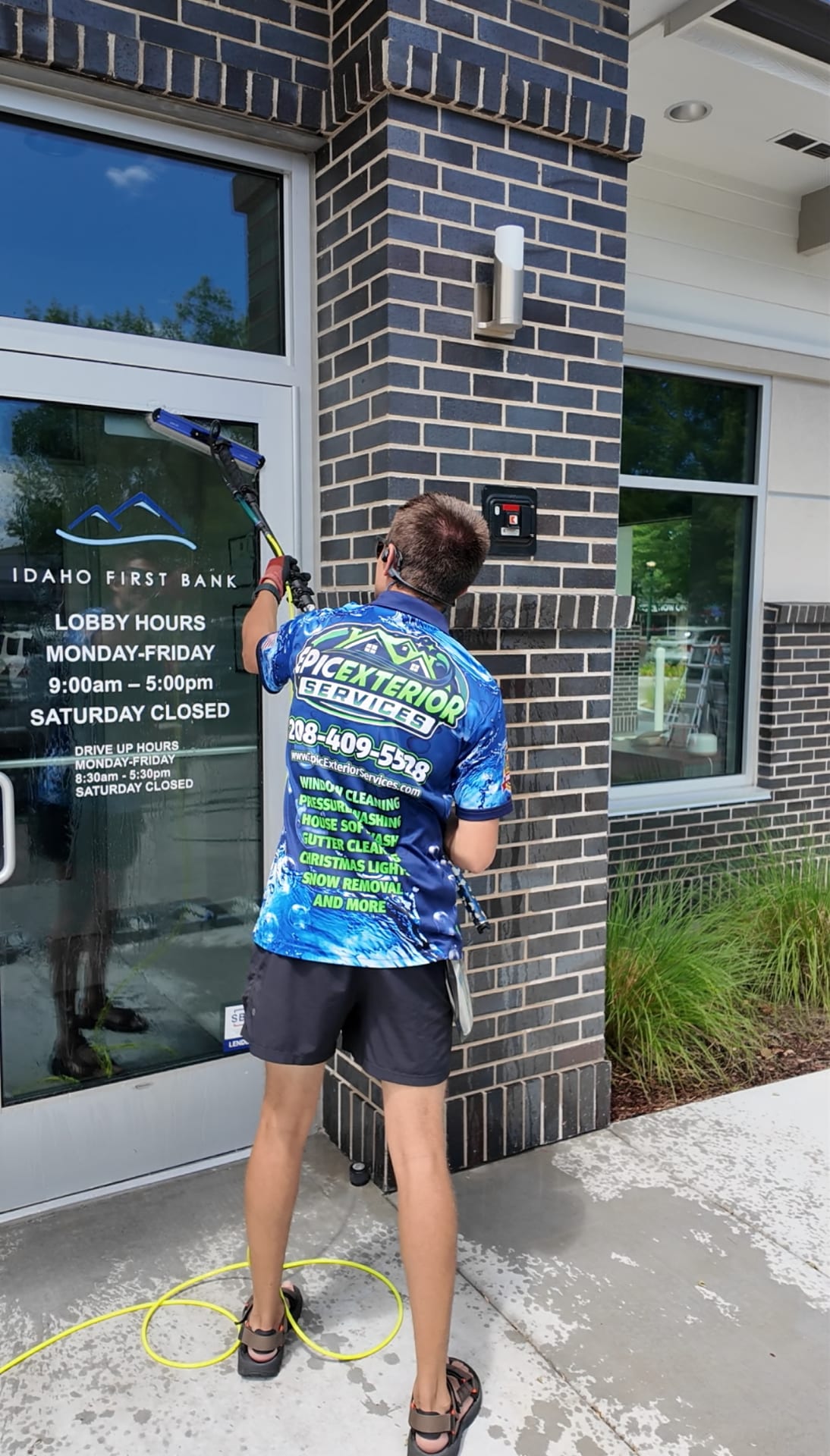 Epic technician cleaning commercial storefront windows